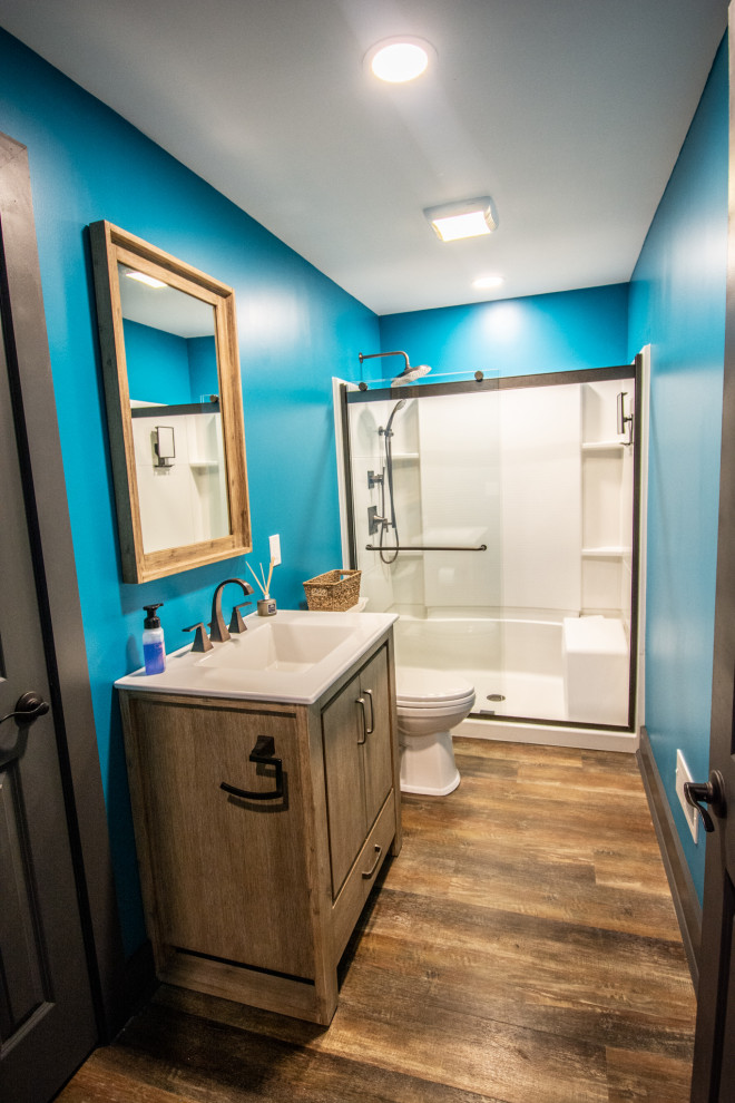 This is an example of an urban bathroom in Other with a single sink and a freestanding vanity unit.