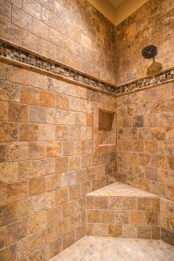 Photo of a mediterranean bathroom in Austin with an open shower, brown tile, stone tile and travertine floors.