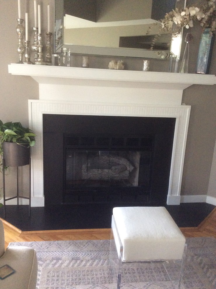 Installing glass tiles around fireplace