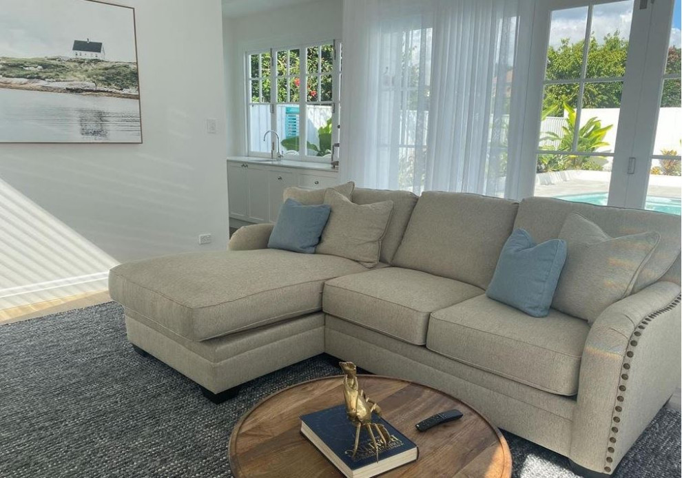 Inspiration for a mid-sized beach style sunroom in Brisbane with vinyl floors, a standard ceiling and brown floor.