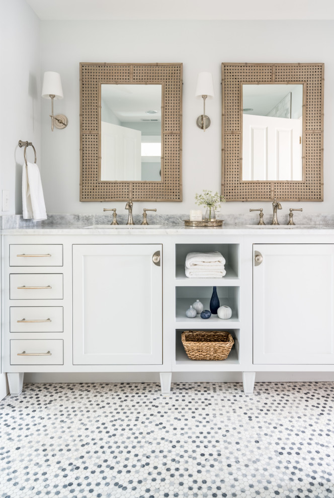 Mid-sized cottage gray tile and marble tile ceramic tile, gray floor and double-sink bathroom photo in Nashville with recessed-panel cabinets, white cabinets, a two-piece toilet, blue walls, an undermount sink, marble countertops, gray countertops and a built-in vanity