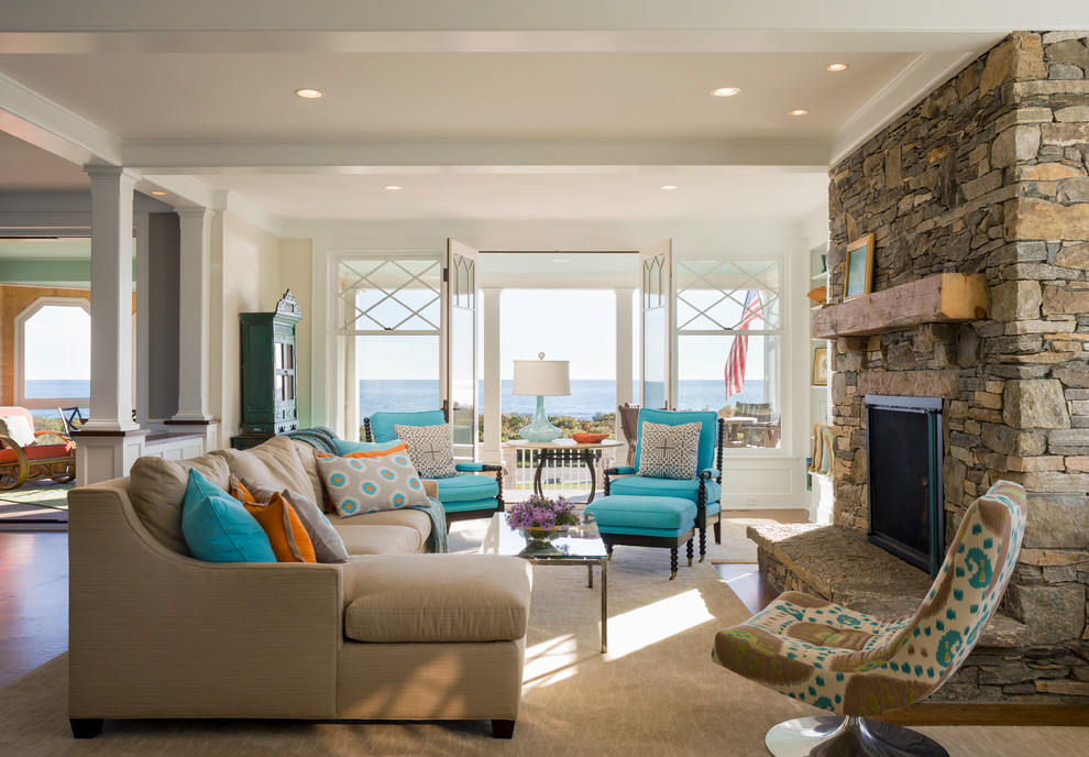 Beach style formal open concept living room in Providence with a standard fireplace and a stone fireplace surround.