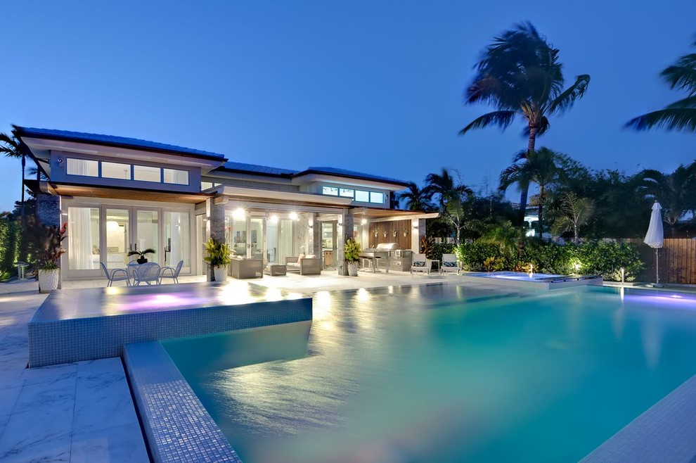 Design ideas for a contemporary rectangular pool in Miami.