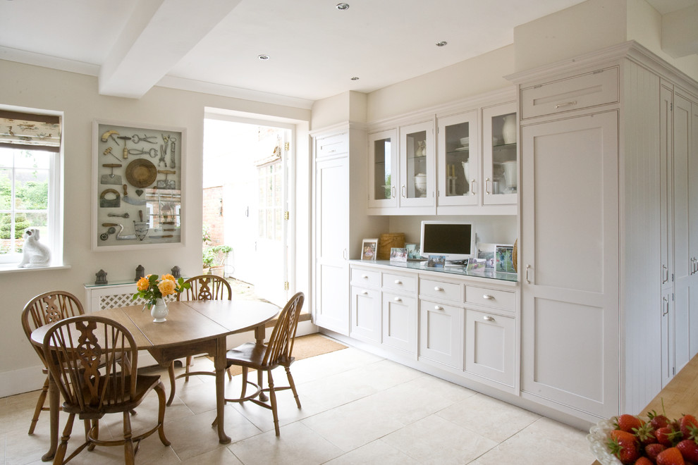 Design ideas for a large transitional l-shaped eat-in kitchen in London with recessed-panel cabinets, white cabinets, granite benchtops, coloured appliances and with island.