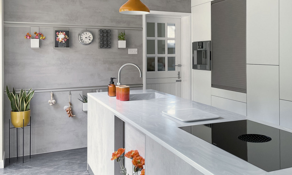 Inspiration for a mid-sized contemporary single-wall ceramic tile eat-in kitchen remodel in Other with an integrated sink, flat-panel cabinets, gray cabinets, quartzite countertops, stainless steel appliances, an island and white countertops