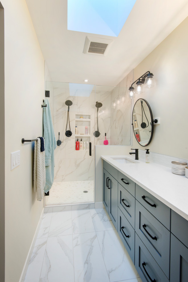 Inspiration for a mid-sized traditional 3/4 bathroom in Calgary with shaker cabinets, grey cabinets, a corner shower, a one-piece toilet, white tile, ceramic tile, white walls, ceramic floors, quartzite benchtops, white floor, a hinged shower door, white benchtops, a single vanity and a built-in vanity.