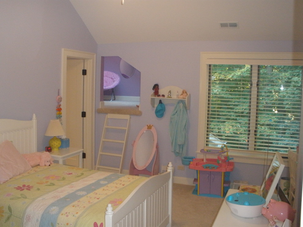 Photo of a traditional kids' room for kids 4-10 years old and girls in Chicago with purple walls and carpet.