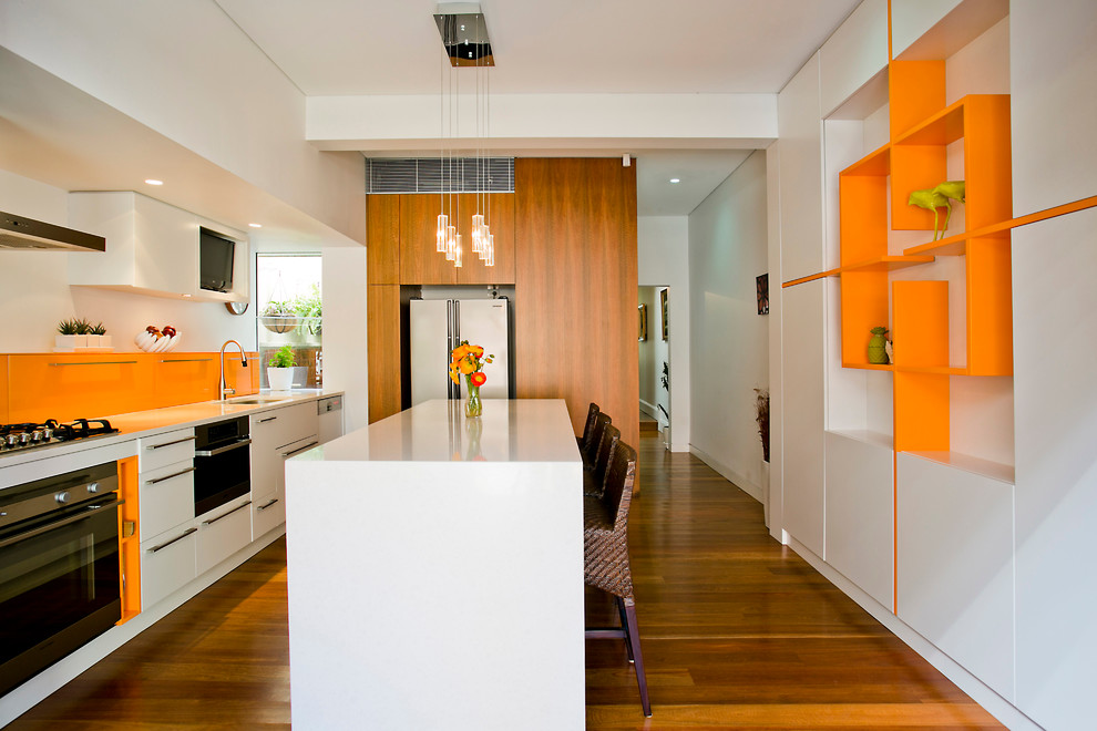 Contemporary kitchen in Sydney with stainless steel appliances.