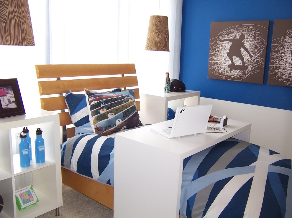 This is an example of an eclectic kids' room for boys in DC Metro with blue walls and carpet.
