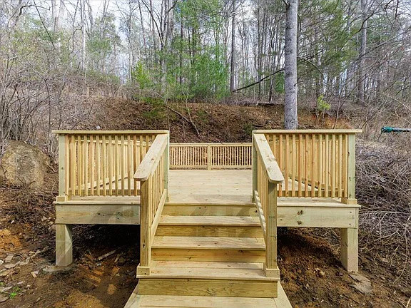 Elevated backyard deck designed to extend the home's living space and provide a functional outdoor gathering area.