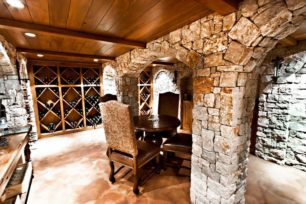 This is an example of a large country wine cellar in Other with diamond bins.