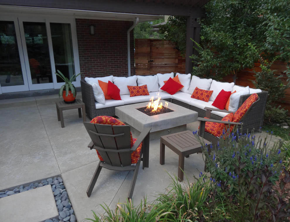 Photo of a contemporary patio in Denver with a fire feature and no cover.