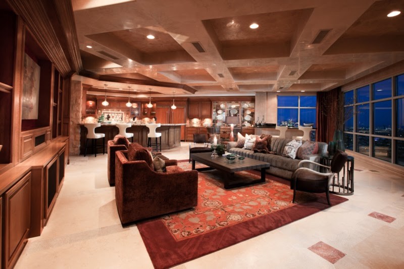 Expansive midcentury formal open concept living room in Las Vegas with marble floors and a built-in media wall.