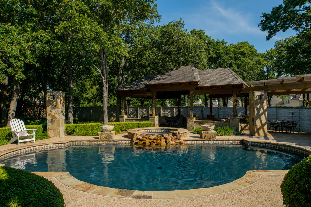 Design ideas for a mid-sized modern backyard custom-shaped natural pool in Dallas with a pool house and gravel.