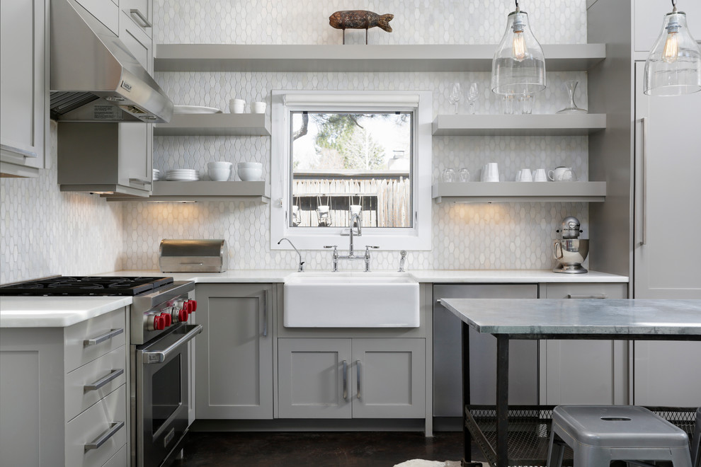 Inspiration for a transitional l-shaped kitchen in Denver with a farmhouse sink, open cabinets, grey cabinets, grey splashback, stainless steel appliances, with island and brown floor.