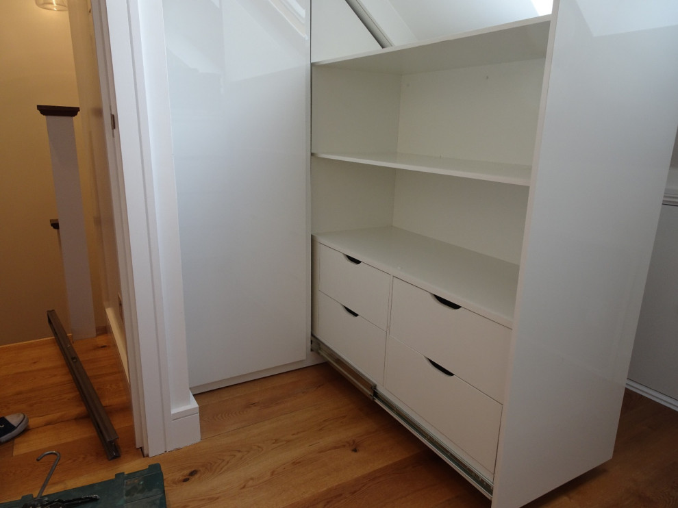 Sliding drawer storage for pitched roof space
