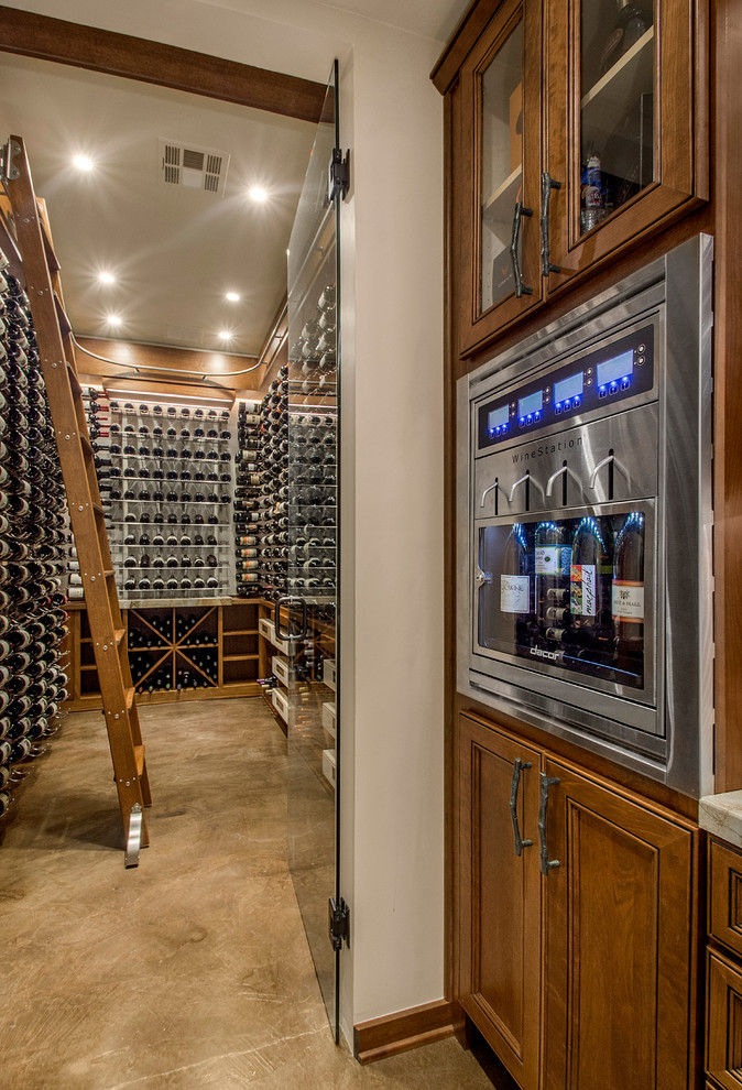 Inspiration for a large transitional wine cellar in Dallas with concrete floors and storage racks.