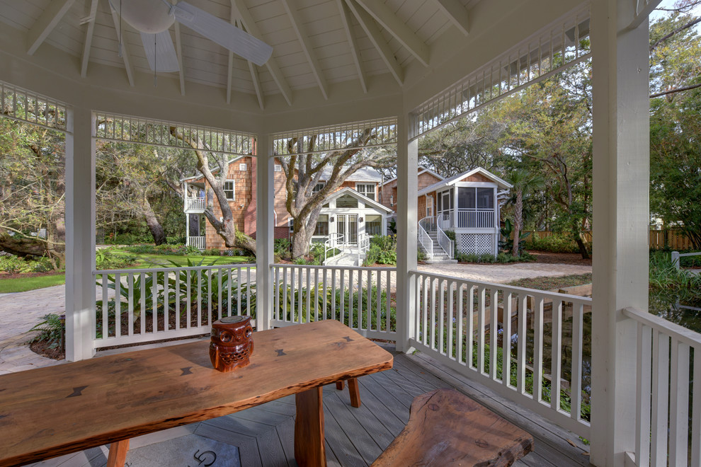 Design ideas for a mid-sized transitional front yard patio in Jacksonville with decking and a gazebo/cabana.