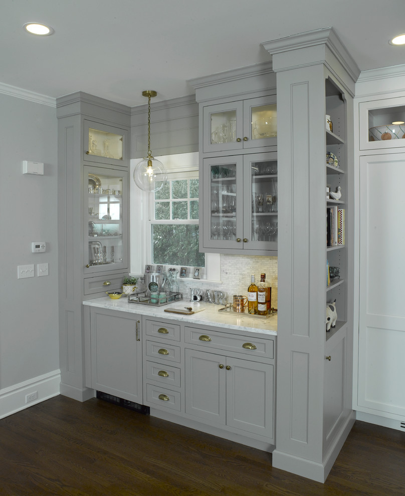 Large transitional l-shaped dark wood floor open concept kitchen photo in New York with flat-panel cabinets, gray cabinets, marble countertops, white backsplash, marble backsplash and an island