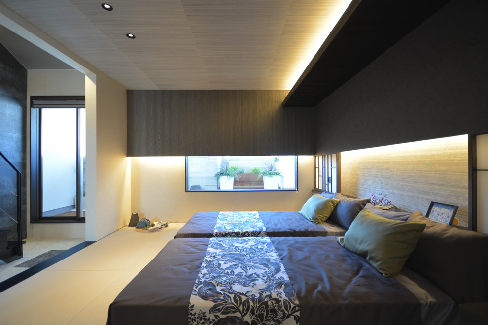 Inspiration for an asian master bedroom in Other with black walls.