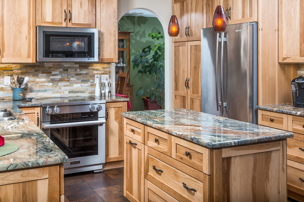 Mid-sized mountain style vinyl floor kitchen photo with an undermount sink, recessed-panel cabinets, light wood cabinets, granite countertops, stainless steel appliances and an island