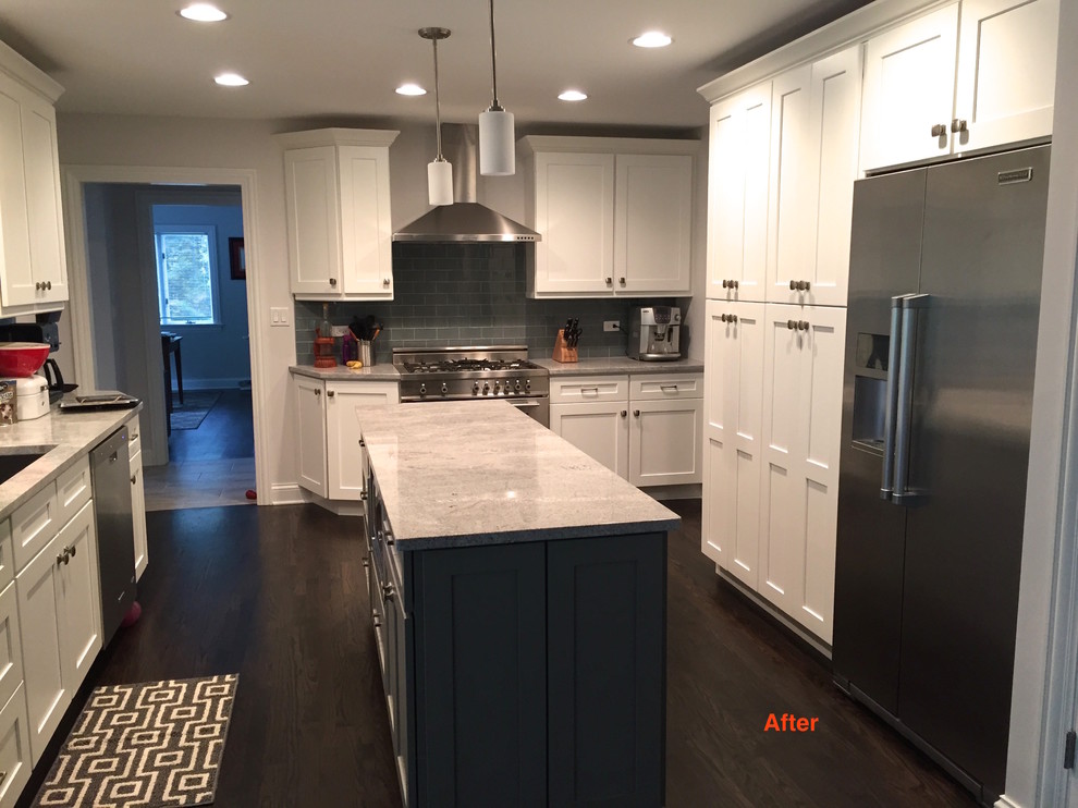 Inspiration for a mid-sized dark wood floor kitchen remodel in Chicago with an undermount sink, white cabinets, granite countertops, gray backsplash, glass tile backsplash and stainless steel appliances