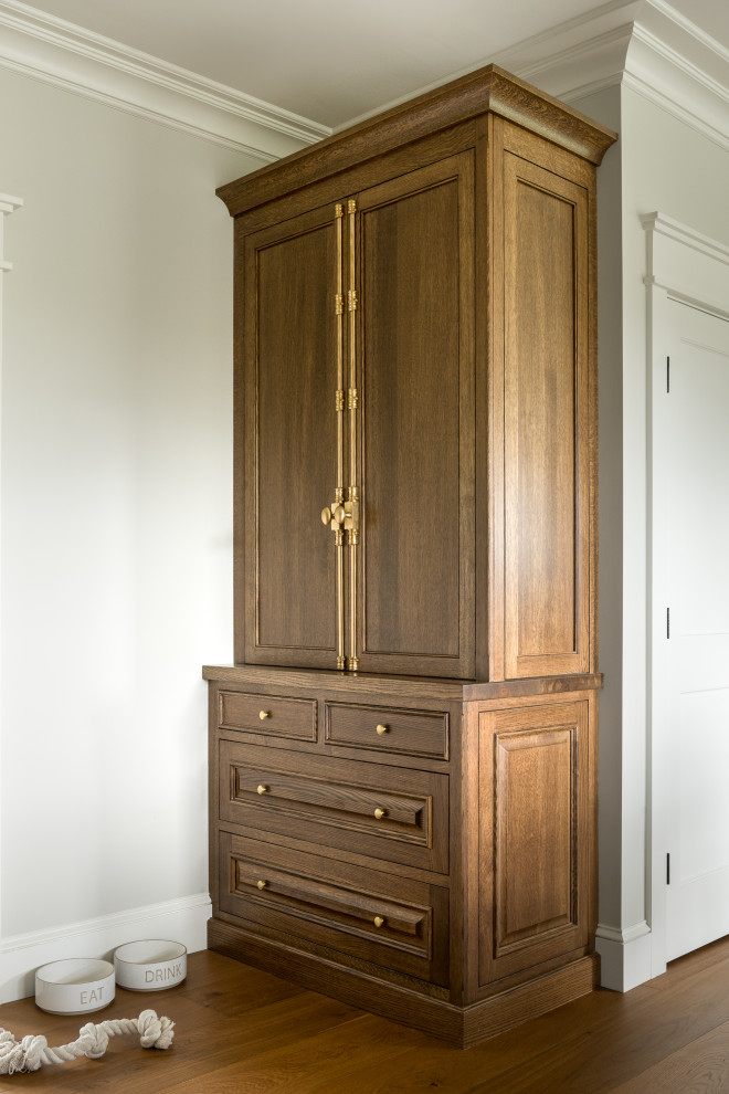 Small transitional medium tone wood floor and wallpaper hallway photo in Burlington