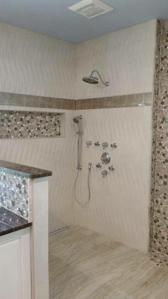 Inspiration for a mid-sized transitional master beige tile, brown tile, white tile and porcelain tile porcelain tile and beige floor doorless shower remodel with open cabinets, white cabinets, white walls and granite countertops