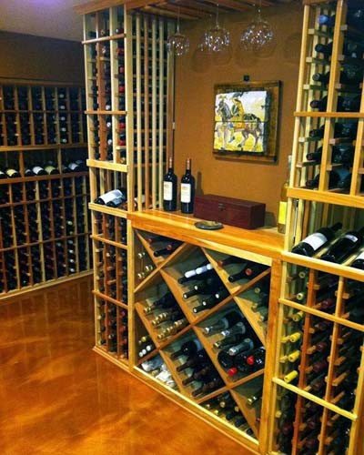 This is an example of a mid-sized traditional wine cellar in Orange County with storage racks.