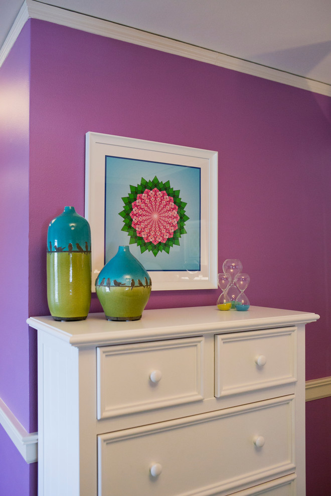 This is an example of a mid-sized contemporary kids' room for girls in Milwaukee with purple walls.