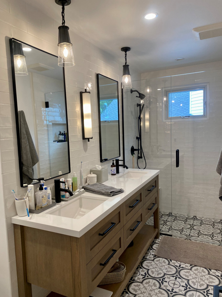 Medium sized farmhouse bathroom in Other with beaded cabinets, light wood cabinets, white tiles, ceramic tiles, porcelain flooring, a submerged sink, engineered stone worktops, multi-coloured floors, a hinged door, white worktops, double sinks and a freestanding vanity unit.
