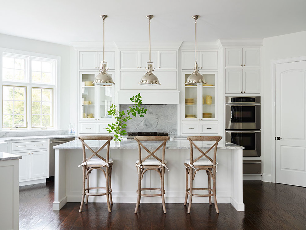 Inspiration for a traditional kitchen in Philadelphia with white cabinets, grey splashback, stainless steel appliances, dark hardwood floors, with island and beaded inset cabinets.