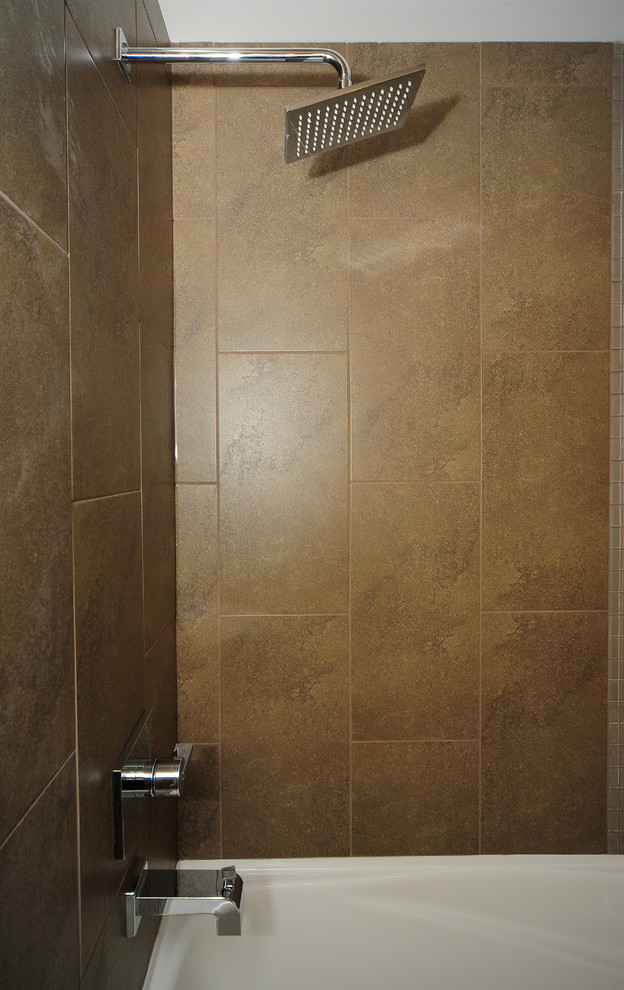 Example of a transitional home design design in Calgary