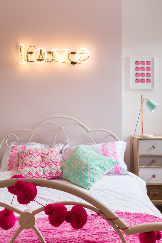 Design ideas for a transitional kids' bedroom for girls in London with pink walls.