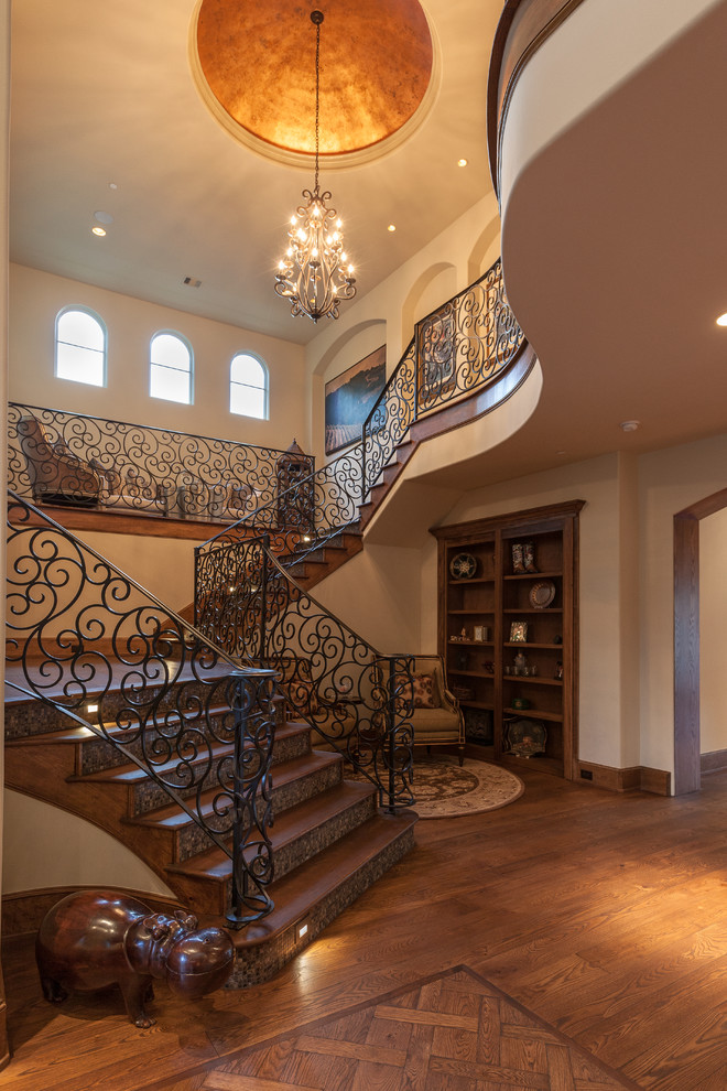 Design ideas for a mediterranean wood u-shaped staircase in Houston with tile risers.