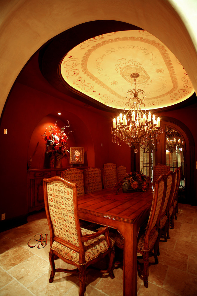 Photo of a mid-sized mediterranean separate dining room in Austin with red walls, ceramic floors and no fireplace.