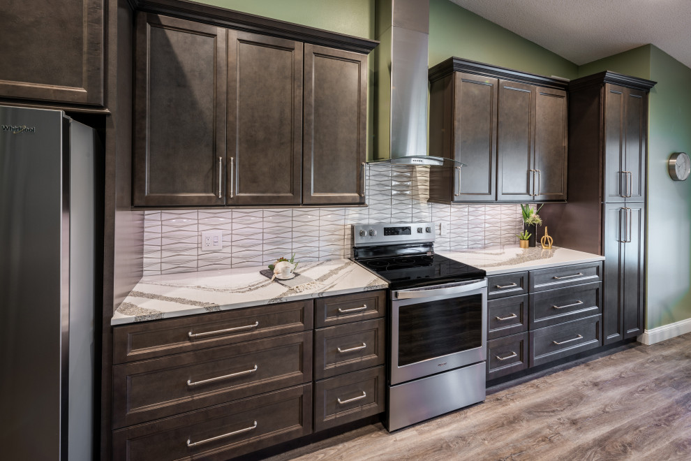 Inspiration for a huge transitional single-wall vinyl floor and gray floor eat-in kitchen remodel in Orlando with an undermount sink, recessed-panel cabinets, gray cabinets, quartz countertops, white backsplash, porcelain backsplash, stainless steel appliances, an island and white countertops