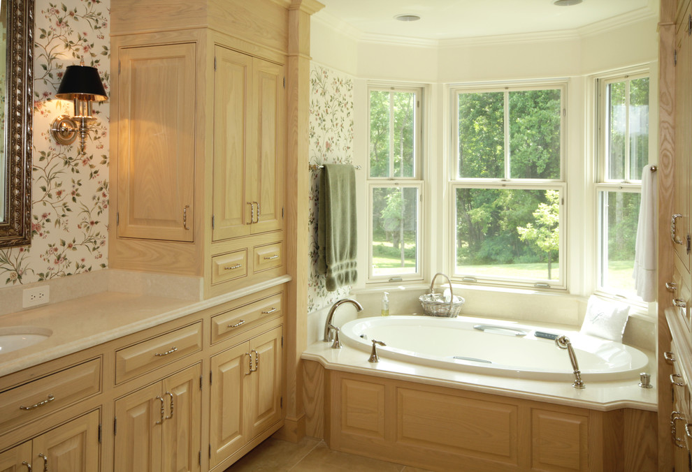 Design ideas for a large country master bathroom in Richmond with an undermount sink, raised-panel cabinets, light wood cabinets, solid surface benchtops, a drop-in tub and an alcove shower.