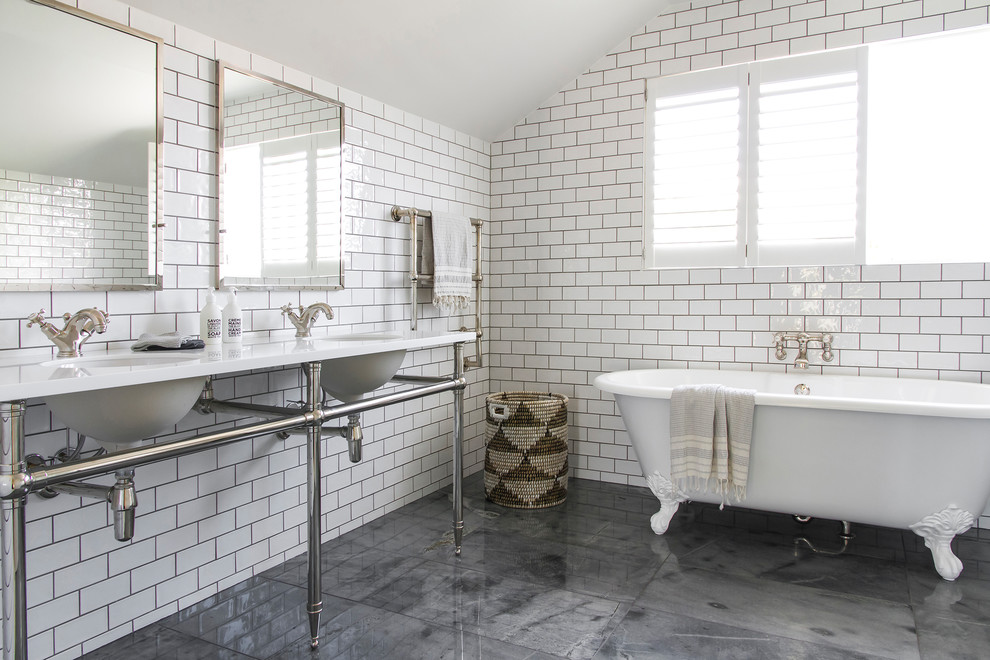 Photo of a large traditional master bathroom in Sydney with open cabinets, white cabinets, a claw-foot tub, a two-piece toilet, white tile, porcelain tile, white walls, slate floors, an undermount sink, solid surface benchtops and a corner shower.