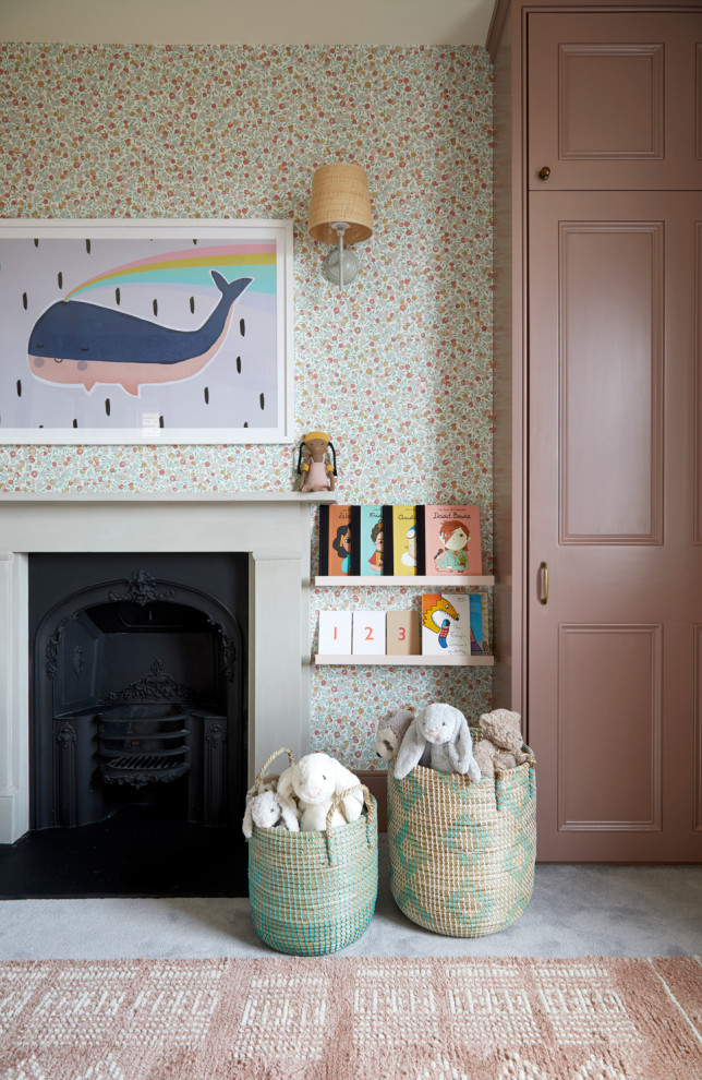 Design ideas for a medium sized contemporary children’s room for girls in London with pink walls, carpet, grey floors, wallpapered walls and a chimney breast.