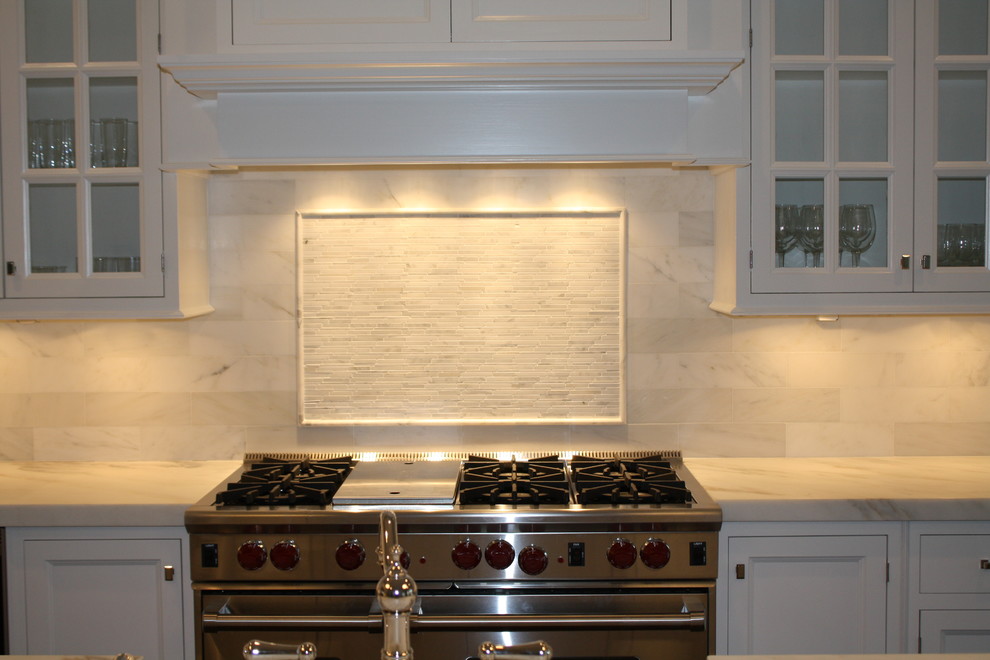 Small kitchen photo in New York with white backsplash and stone tile backsplash
