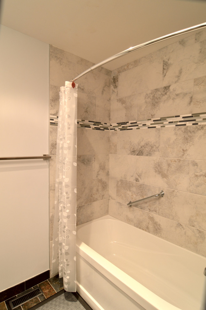 This is an example of a mid-sized contemporary master bathroom in Calgary with a drop-in tub, a shower/bathtub combo, white walls and ceramic floors.