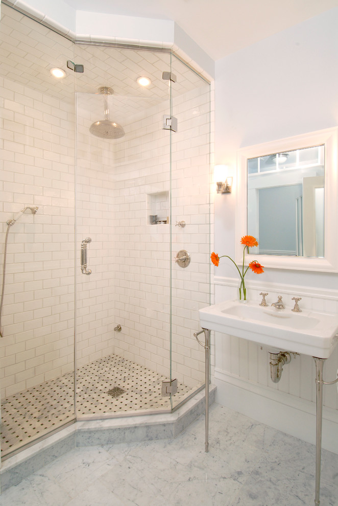 Photo of a large traditional master bathroom in Boston with a console sink, white tile, subway tile, a corner shower and marble floors.