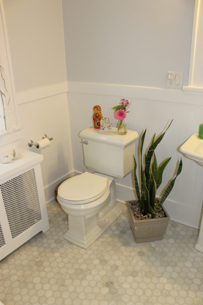 Design ideas for a small traditional bathroom in Other with a pedestal sink, a drop-in tub, a shower/bathtub combo, a two-piece toilet, open cabinets, white cabinets, gray tile, stone tile, grey walls and marble floors.