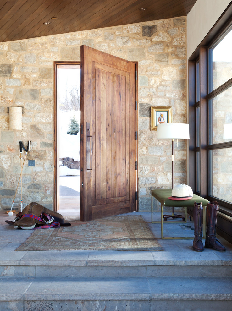 Inspiration for a transitional entryway in Denver with multi-coloured walls, a single front door and a medium wood front door.