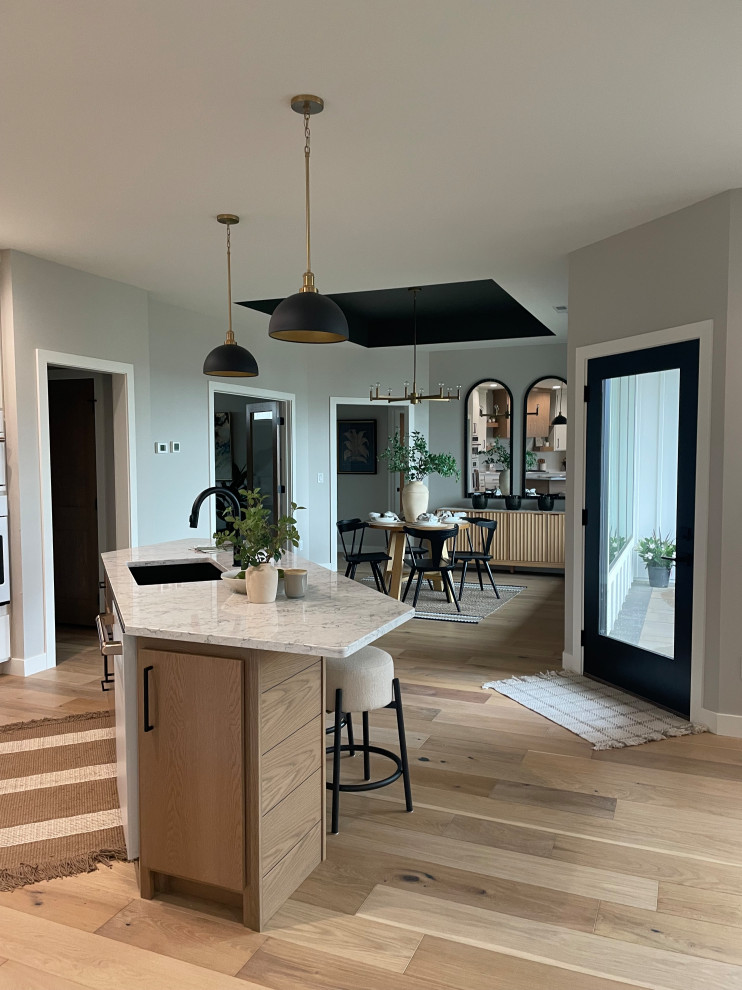 Eat-in kitchen - scandinavian eat-in kitchen idea with flat-panel cabinets and an island