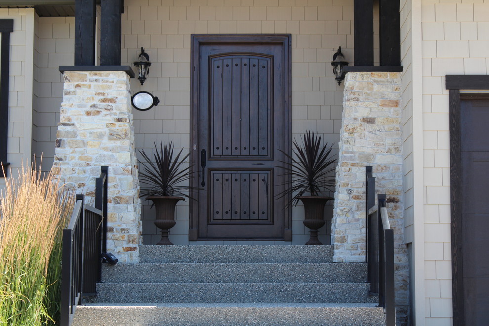 Mid-sized mountain style front door photo in Vancouver with a dark wood front door