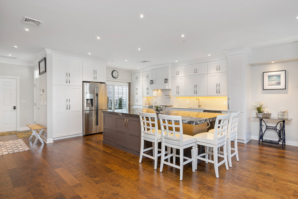 Example of a transitional home design design in Boston