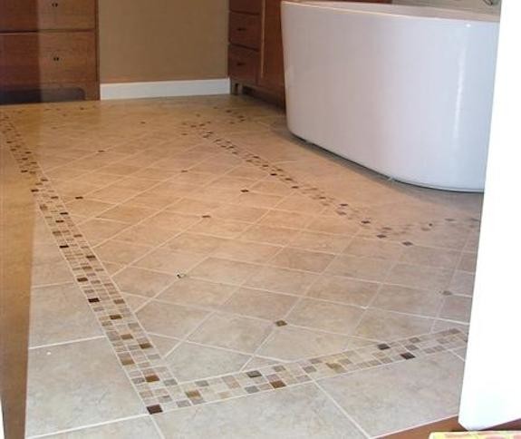 Inspiration for a mid-sized mediterranean 3/4 bathroom in Portland Maine with flat-panel cabinets, medium wood cabinets, a freestanding tub, beige tile, ceramic tile, brown walls and ceramic floors.
