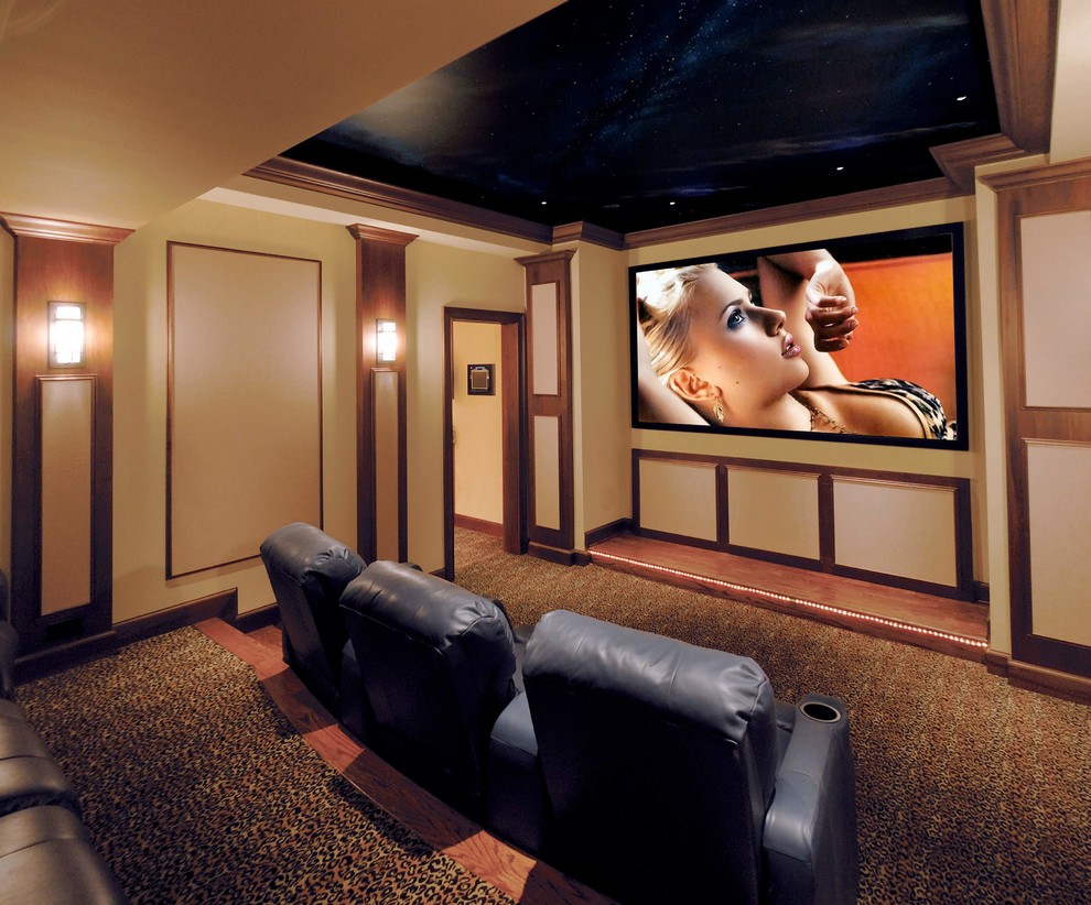 Large modern enclosed home theatre in Atlanta with beige walls, carpet, a built-in media wall and multi-coloured floor.